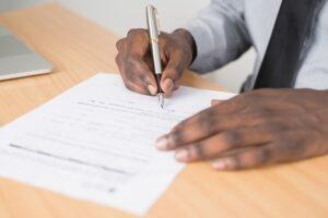 man filling out paperwork